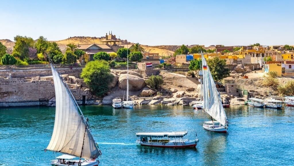 Sunlight over boats on Nile in Aswan, Egypt