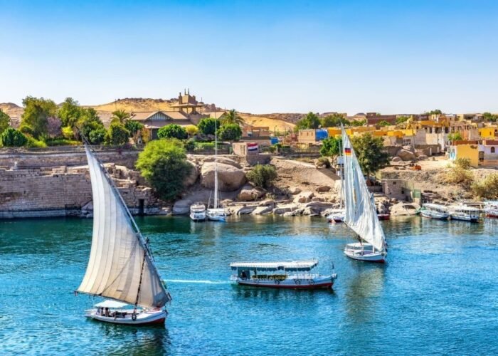 Sunlight over boats on Nile in Aswan, Egypt